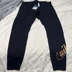 Women’s Black and Gold Nike Leggings size medium